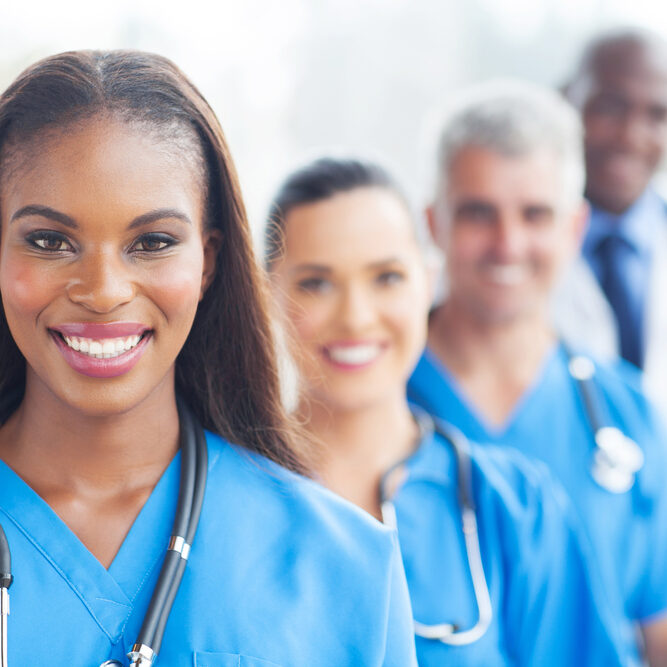 group of happy healthcare workers line up